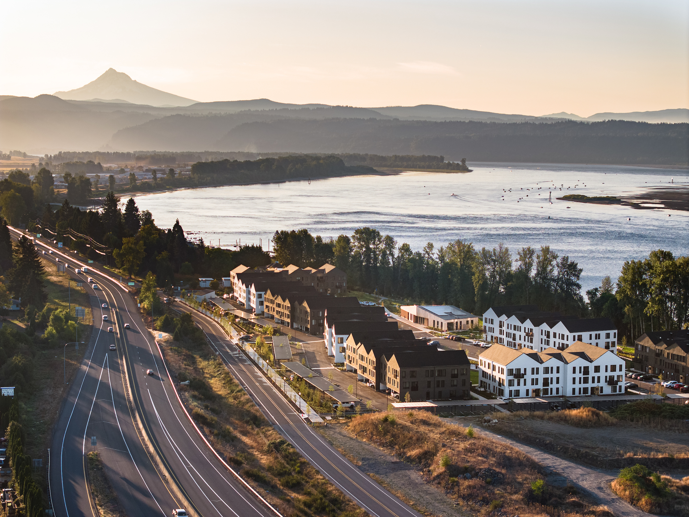 Photo of Ninebark apartments with Columbia River and Mt Hood in the background.